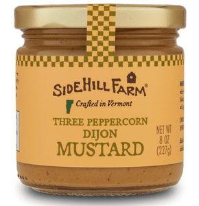 Front view of a jar of 3 Peppercorn Dijon mustard