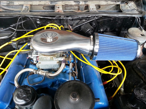 Carburetor adapter and cone filter installed on carburetor. NOT INCLUDED