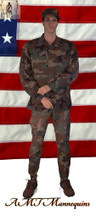 In this full body rear view photo, wearing a military field dress with boots,  mannequin Bill, stands with his legs even, his arms raised to his waist with his left hand almost touching his right arm.  Mannequin Bill can be displayed with or without a wig / hairpiece.  Glass stand and support hardware included.