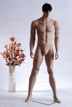 In this full body view photo, wearing a short dark brunette wig / hairpiece, mannequin Matt stands with his legs apart in an even stance, with both hands almost straight down at hip level.  Mannequin Matt can be displayed with or without a wig / hairpiece.  Glass stand and support hardware included.