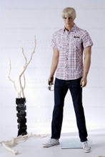 In this full body side view photo, wearing a short blond wig / hairpiece, black slacks, tennis shoes, and a plaid short-sleeved shirt, mannequin Matt stands with his legs apart in an even stance, with both hands almost straight down at hip level.  Mannequin Matt can be displayed with or without a wig / hairpiece.  Glass stand and support hardware included.