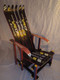 The Sierra Chair. This piece uses vintage 60's skis. The wooden bottom and sides, are hand stained with lively colors, accenting the ski graphics.