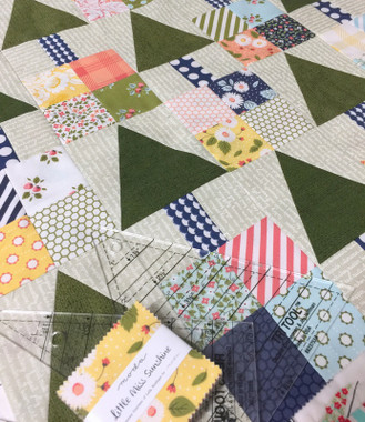 Templates are included in the pattern but the EZ Quilting Tr-Rec tool makes cutting and sewing the triangles in a square a breeze.