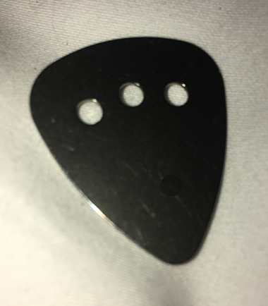Some of you wanted a perfectly flat solid metal pick that won't wear.  For those who demand total consistency over time and who believe flexibility and "breaking in" are functions that lie beyond the start of ones sound, we introduce TITANIUM!  May it provide a sense of permanence in our rapidly changing world!
