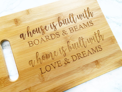 A house is built with Boards & Beams Cutting Board