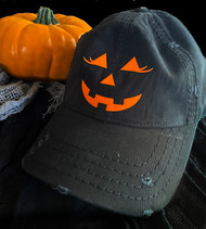 Jack-o-lantern with eyelashes pumpkin cap
