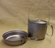 Here's the 1400 with the titanium lid on the pot. Get two titanium lids, and you'll have lids for both the pan and pot!