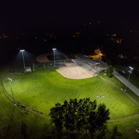 Complete LED sports lighting package including LED Helios fixtures, custom steel sports poles, brackets, and Glare Killer systems.
