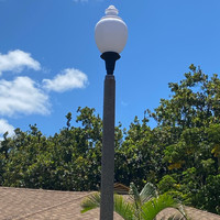 LED post top light fixture installed on concrete light pole