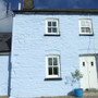 Farmhouse painted with Earthborn Silicate Masonry Paint (Colour: Cobalt Blue).