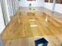 Treatex Hardwax oil being applied to a wooden floor