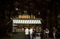 Customers line up at a sausage stand in Berlin, Germany