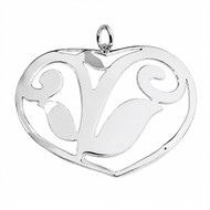 Large ornate cutout heart pendant handmade in Peru from 950 silver, featuring an openwork heart design with decorative curved silver detailing.