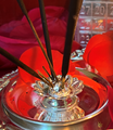 5 stick incense holder with attached silver tray.