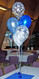 5 Balloon Centerpiece, using Pearlized and Printed Clear Latex, tied to a Foil Weight.