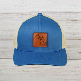 leather patch trucker hat