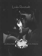 'Round Midnight by Linda Ronstadt and Nelson Riddle. For Piano/Vocal/Guitar. Artist/Personality; Personality Book; Piano/Vocal/Chords. Piano/Vocal/Guitar Artist Songbook. Pop Rock, Standards and Vocal Standards. Difficulty: medium. Songbook. Vocal melody, piano accompaniment, lyrics, chord names, guitar chord diagrams and color photos. 140 pages. Alfred Music Publishing #VF1361. Published by Alfred Music Publishing.

Linda Ronstadt with Nelson Riddle and his Orchestra. Includes songs from three albums: LUSH LIFE, FOR SENTIMENTAL REASONS, and WHAT's NEW? Skylark * Am I Blue? * My Funny Valentine * I've Got a Crush on You and more.