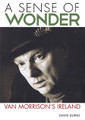 A Sense of Wonder (Van Morrison's Ireland). Book. Softcover. 272 pages. Published by Jawbone Press.

Long before there was a peace process in Ireland, Van Morrison unwittingly did his bit to unite a nation divided. Born in the heart of East Belfast in the North, he is revered as a Celtic soul hero in the South. His music, while rooted in jazz and blues and soul, has an Irish accent – a distinctly Protestant Irish accent.

Morrison's songs form a map of this small island – a map of places, people, and cultures, too. They evoke a long-ago Belfast at a time before it became violently divided by sectarian conflict during the Troubles. They laud literary giants James Joyce, W.B. Yeats, and Oscar Wilde. They tell of the immigrant experience, the going away from the land that has long been Ireland's heartache. And they form a map of Morrison himself, revealing more than this notoriously difficult character ever would in interviews or conversations.

A Sense of Wonder is not a biography of Van Morrison. Rather, it is a journey through the Ireland depicted in his songs – a journey that begins in Hyndford Street, where we encounter the likes of John McCormack and the McPeake family, and culminates in a unique picture of an idyllic, almost mythical Ireland where spirituality trumps organized religion, and art yields a stronger legacy than politics.

Drawing on original research and interviews with a wide range of characters – from collaborators and associates of Morrison to Northern Ireland First Minister Peter Robinson and actor Liam Neeson – this is a book about the Ireland that made Morrison, and the Ireland that he has remade himself through a stunning, sprawling body of work that spans almost six decades.