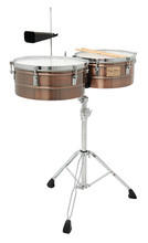 Antique Copper Shell Timbales (14 inch. and 15 inch.). For Percussion. Tycoon. Tycoon Percussion #TTI-1415 AC. Published by Tycoon Percussion.

Superior quality and authenticity in sound make this a great addition for any professional or advanced player's set up. The 14″ and 15″ diameter antique copper shells feature chrome hardware. Includes heavy duty, fully height-adjustable, tilting timbale stand, cowbell mounting bracket, Tycoon TW-60 cowbell, pair of timbale sticks, and tuning wrench.