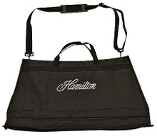 Portable Music Stand Carrying Bag (For KB50 and KB990 Models). Hamilton Stands. Hal Leonard #KB14. Published by Hal Leonard.

This bag is made of heavy duty Cordura type polyester cloth and has 3 compartments – one for the desk, one for the folding base, and an accessory pouch. The desk and base compartments sport zipper closures and the accessory pouch has a velcro closure. The bag, which features an embroidered Hamilton Stands logo, includes both a handle and carrying strap.
