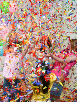 girls-playing-with-confetti-and-streamers.jpg