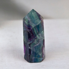 Fluorite is known to stabilize mental and emotional systems, increase the ability to concentrate and balance disorder.


Fluorite Pillar - approx. 2 7/8 inches in height and approx. 1 inch in diameter.  Weight is .25 lbs or 4 oz.  This pillar is six sides, pointed on one end and flat on the other.  The Fluorite Pillar pictured is the one you will be receiving upon purchase of this item