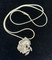 Beautiful detail in this Sterling Silver pendant.  This rearing stallion is as beautiful as he is fierce.  Comes with an 20 inch Sterling Silver snake chain.  Pendant is over 3/4 inch wide and 1 inch tall.