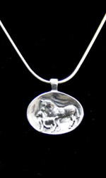 This Sterling Silver pendant has an antique heirloom feel and look.  The Mare and her Foal grace this oval shape pendant.  Comes with a 20 inch Sterling Silver Snake Chain.  Pendant is 1 inch long and 3/4 inches high.