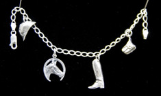 This Sterling Silver charm bracelet is perfect for any horse lover! Featuring riding helmet, horseshoe with horse head, cowboy boot, and saddle bag charms. Makes a great gift for any occasion! 