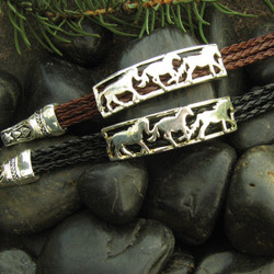  Capturing the beauty and freedom of the horse, this bracelet is a stylish piece for all ages. Available on black or brown cord, this bracelet is a timeless piece of jewelry perfect for every horse lover.

• Made of Rhodium plated metal alloy and synthetic braided leather
• Each piece is lead free / nickle free / hypo-allergenic
• Bracelet measures 7" long
• The magnetic closure secures the bracelet while making it easier put on and off.
• From the Wyo-Horse horse jewelry collection
• Created by jewelry designer Kerstin Stock 