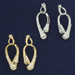 Rhinestone Encrusted Horseshoe Nail Earrings 
Available in a Gold or Silver tone.
Hanging horseshoe nail earrings measures 1 5/8" tall.
Surgical steel posts
All lead free, nickel free, hypo-allergenic.