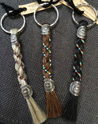 Horse Hair Key Chains were Cowboy Collectible's first product!

The owner made her first key chain on the banks of a river in Montana over eighteen years ago and their products are still handmade in Montana to this day. These key chains are available with colorful bead work accents.  Approx. 6 inches in length including the key ring.