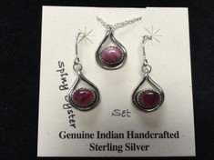 Spiny Oyster "stones" are beautiful set in this Sterling Silver drop earrings and matching pendent set. This set features stones that have a purpleish color.

Spiny Oyster is truly made from Spiny Oyster shells.   These oysters have shells that range in colors and shades from pinks, reds, oranges, browns, yellows and even purples.

These are genuine Indian handcrafted Sterling Silver items.  Chain is included with set.

Earrings and pendent measure approx. 1/2 in. long.