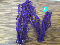 Purple Hay Net; The multiple strands of strong poly cord with rings. This hay net helps hay stay in place.  Holds up to one or two good size flakes of hay. This Poly hay net is perfect for holding hay at shows, in the trailer or at home.