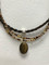 Another winner from Cowboy Collectibles!  Cabochon Necklace with authentic Horse Hair and beads and matching earrings.
cab·o·chon
ˈkabəˌSHän
noun: cabochon; plural noun: cabochons meaning - a gem polished but not faceted.
These stunning horse hair necklaces are 18" long, have a lobster claw closure, feature a stone cabochon with coordinating beads.  Matching earrings feature hypo-allergenic posts.                                                                   
Add a coordinating beaded wrap bracelet to complete the look.
Handmade in Montana USA