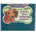 A spoiled rotten dachshund lives here sign