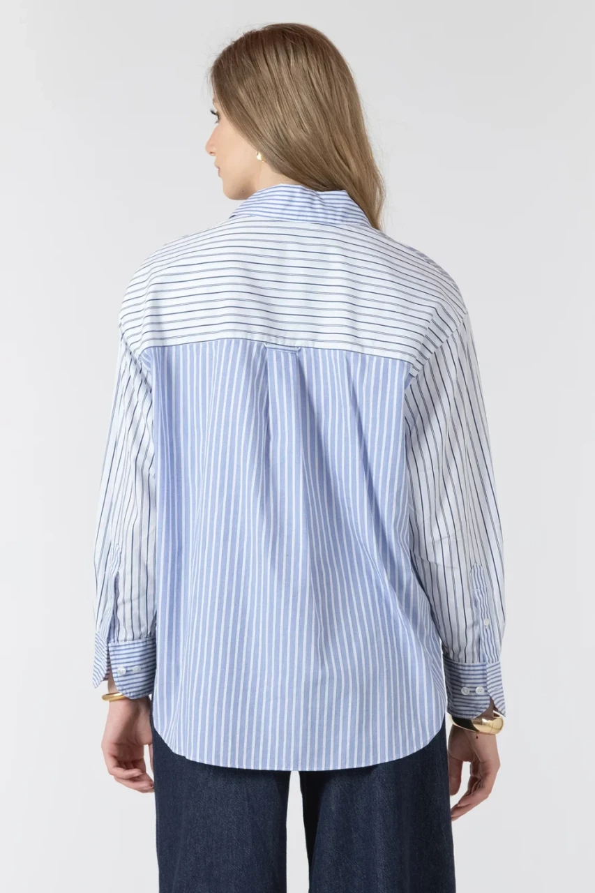 Back view of Black Tape neutral button front shirt showing clean drape and curved hem