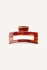Front view of Kōv Essentials small daily hair claw clip in spice red-toned tortoiseshell on a white background