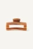 Front view of Kōv Essentials daily hair claw clip in honey caramel color on a white background
