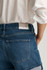 Back view of Mavi Heidi mid brushed classic blue cuffed shorts showing back pockets, waist fit, and folded hem