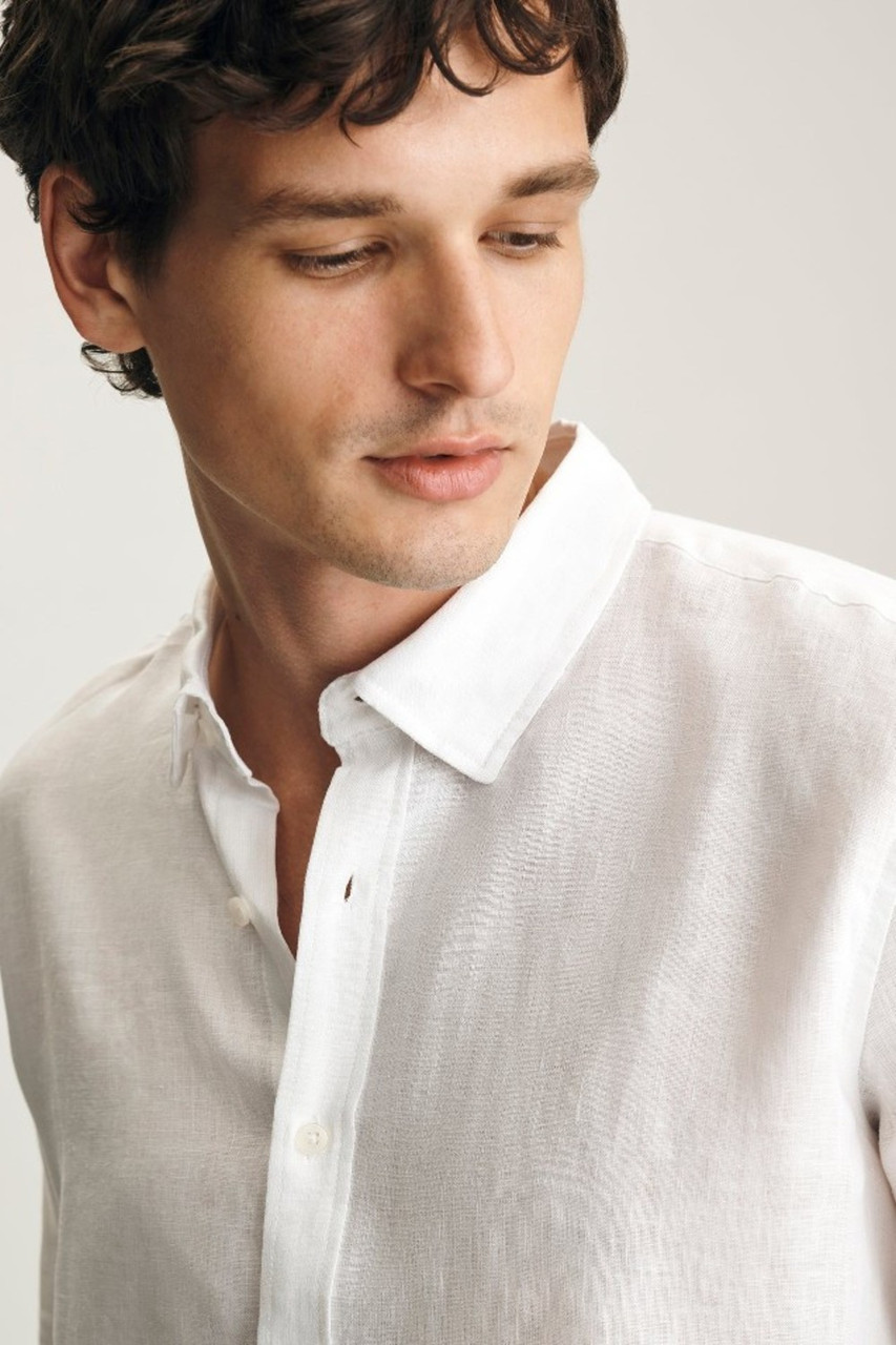 Front view of Mavi linen button-up shirt in white showing collar, front button placket, and relaxed fit
