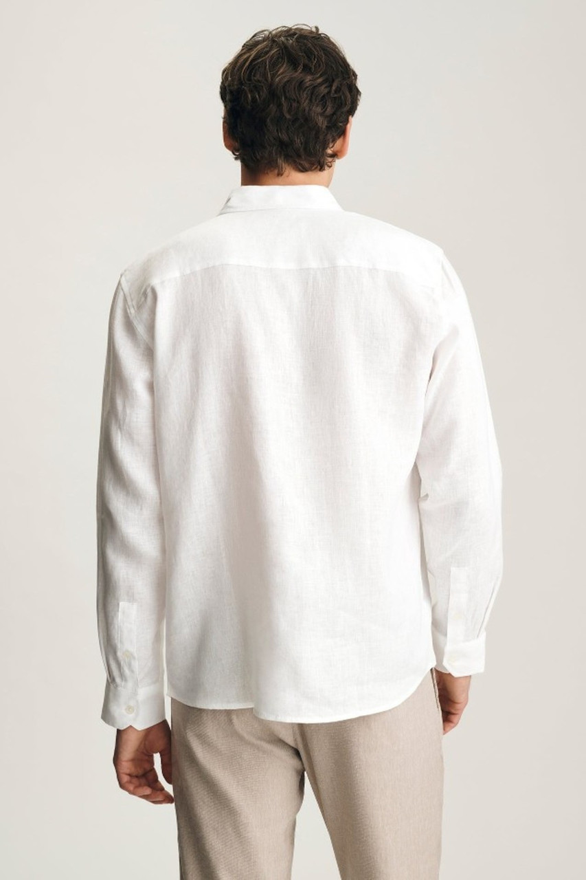Back view of Mavi white linen button-up shirt showing back yoke and curved hemline