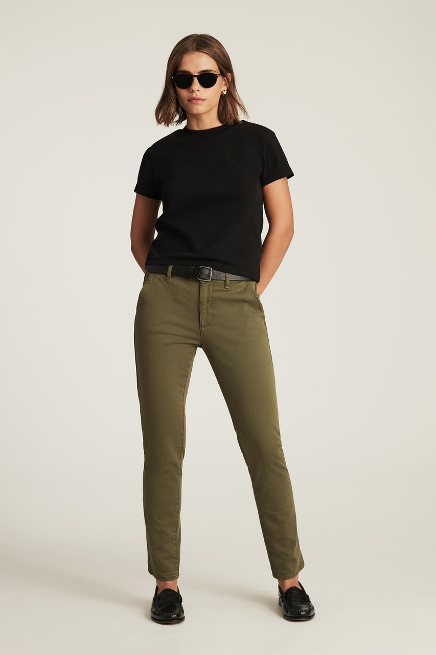 Full-length portrait of model wearing black Mavi Layla ribbed baby tee styled casually