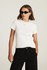Model wearing Mavi Layla white baby t-shirt highlighting the short sleeves and slim silhouette