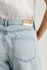 Back view of Mavi Nella bleached linen denim high rise shorts showing back pockets and waist fit