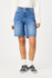 Close-up detail view of the mid brushed classic blue denim texture, folded cuff hem, and front pockets