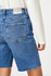 Back view of Mavi Heidi mid brushed classic blue high rise cuffed shorts showing back pockets and waist fit