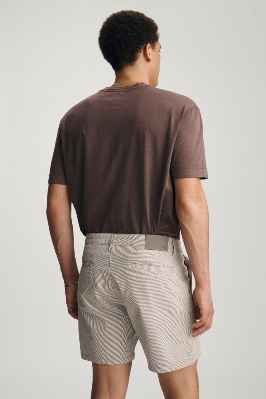 Model posing back view of Mavi Nate sand seersucker shorts showing back welt pockets and waist fit