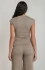 Back view of a woman wearing the fitted neutral tank top and wide-leg trousers set.