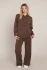 Full-length portrait of model wearing Dex scuba pull-on trousers styled with a casual top